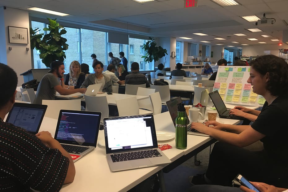 Group at CivicTechTO hacknight working on a project